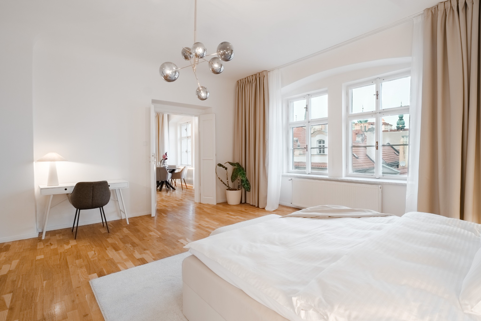 Large king bedroom with Prague rooftop views